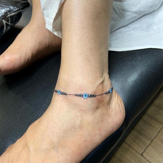 evil eye bracelet tattoo design woman above ankle