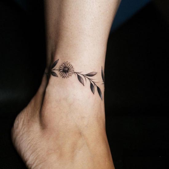 floral leaves sunflower wrap around ankle tattoo design female 1