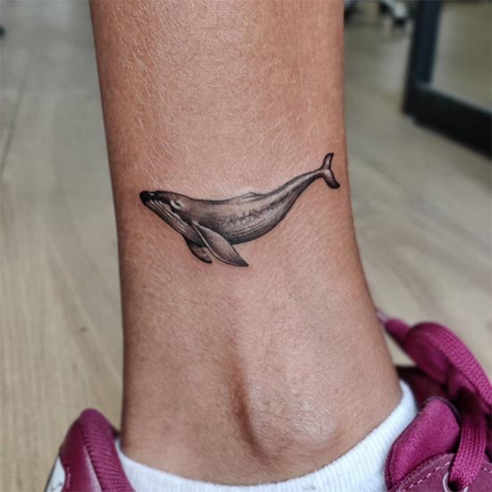 small whale tattoo design female inner ankle black and grey