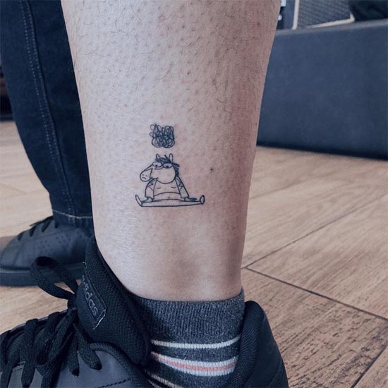 tiny cartoon tattoo design woman ankle