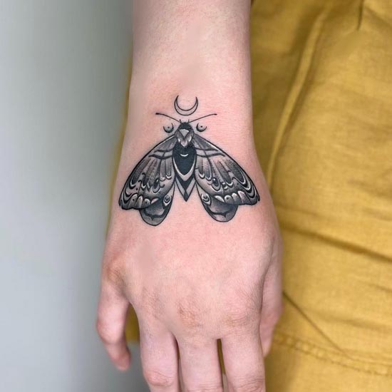 moth tattoo design idea dotwork girl lower arm wrist