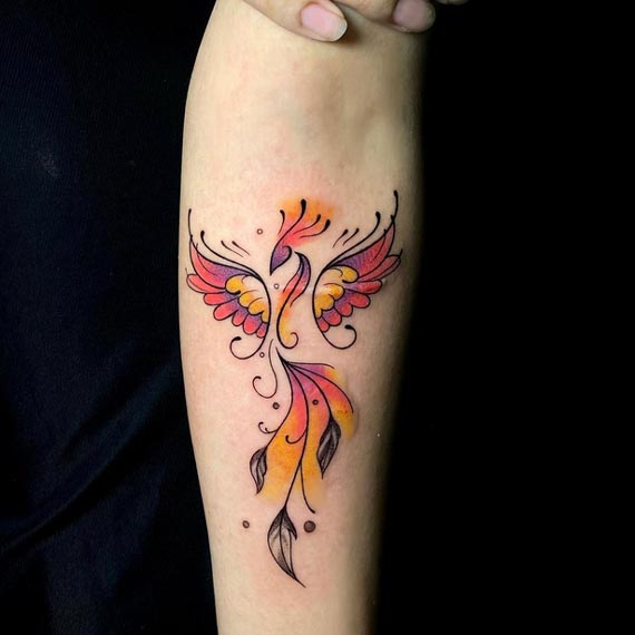 phoenix bird tattoo watercolor woman inner arm forearm