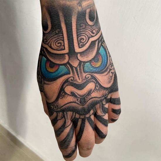 traditional samurai mask tattoo design man lower arm hand