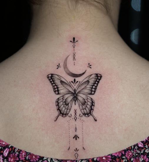 butterfly moon ornamental tattoo female back black and grey