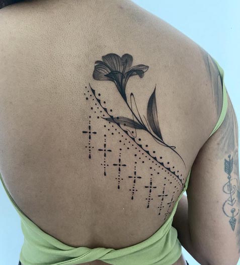 lily flower ornamental tattoo design female half back