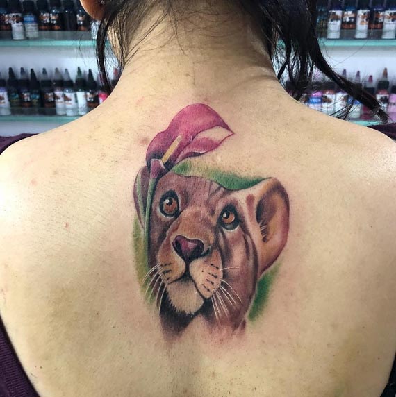 lioness head color tattoo design woman back