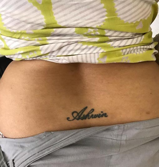 name tattoo female lower back