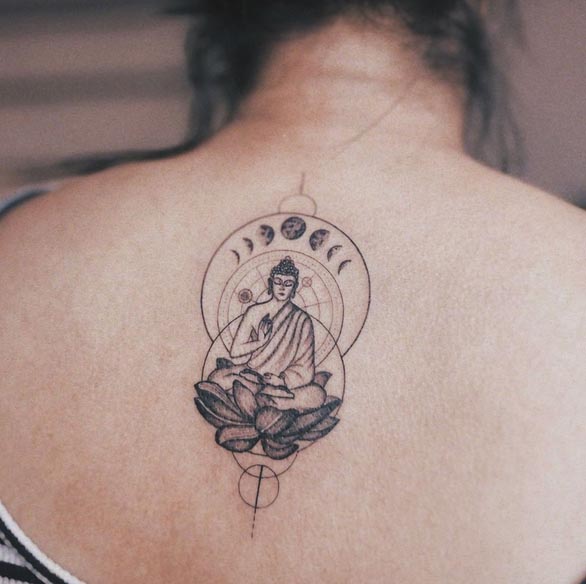 minimal buddha on lotus behing circles and moon phases tattoo female back