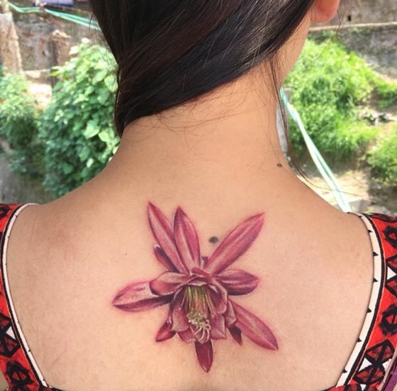 pink color lily flower tattoo design girl back