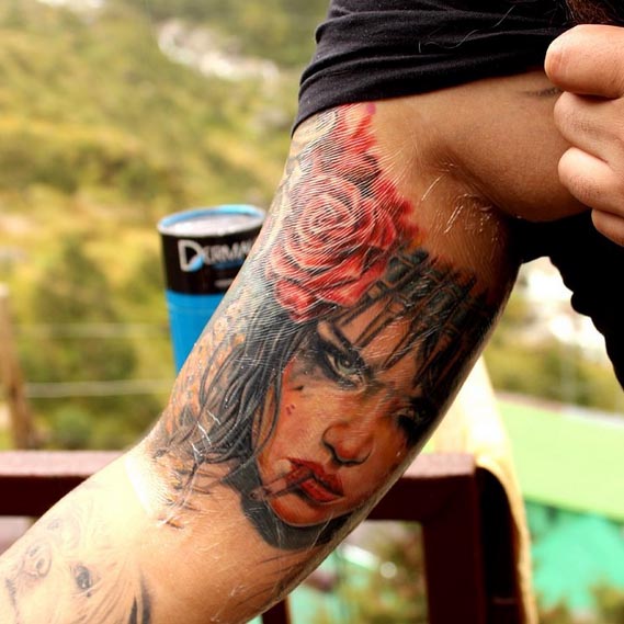 brian viveros with rose color tattoo guy inner bicep