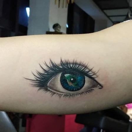 eye tattoo design idea realistic woman inner bicep