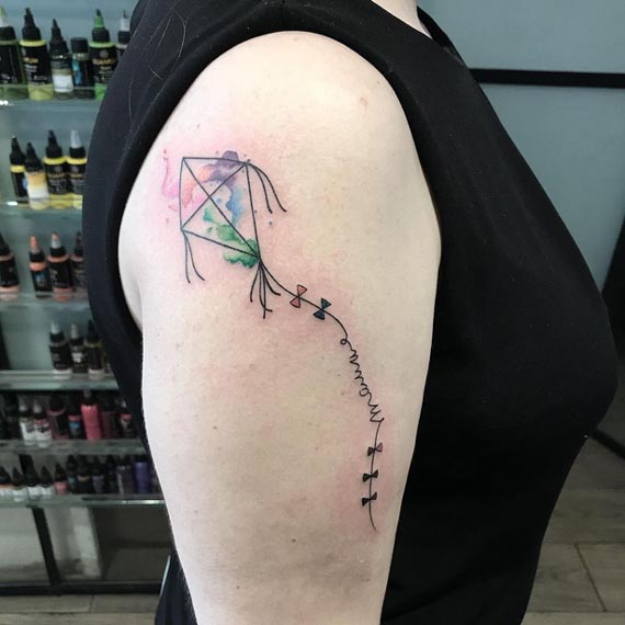 watercolour kite tattoo design lady arm bicep