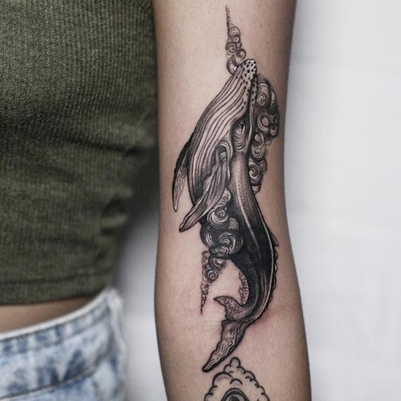 whale tattoo abstract woman front bicep