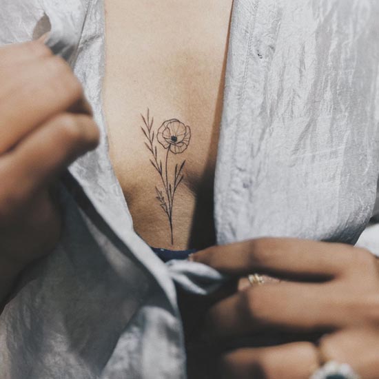 flower fine line tattoo design female middle breast