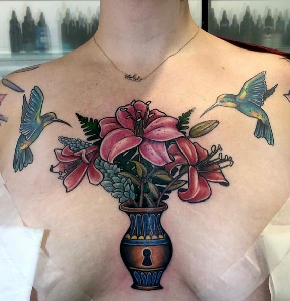 flower vase hummingbird tattoo design woman chest above breast