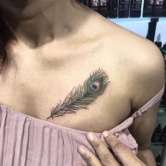 peacock feather tattoo design color female above breast