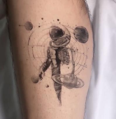 astronaut universe geometric pattern tattoo fine line man calf