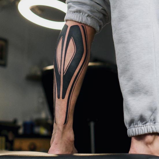 blackwork tattoo design idea man calf