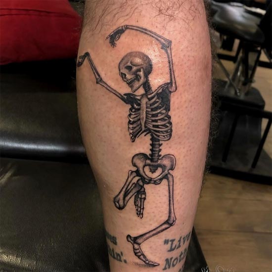 dancing skeleton tattoo design idea man calf