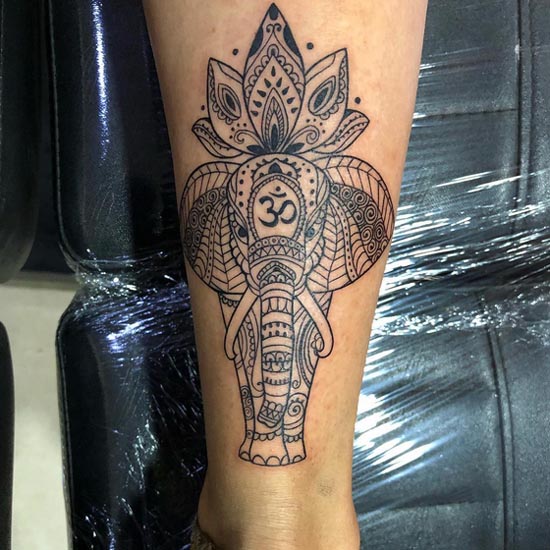 elephant henna tattoo design idea woman lower calf