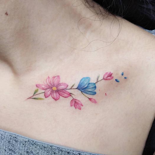 colored floral elegant tattoo design lady above collarbone