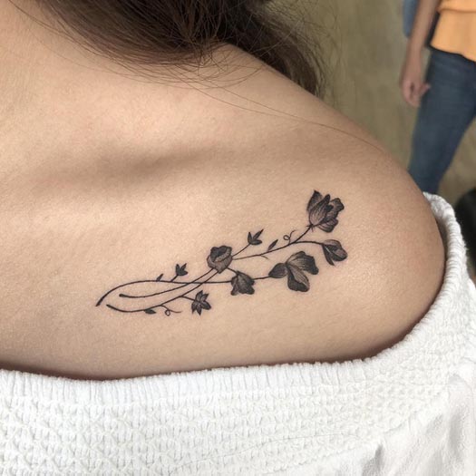 ivy flower delicate tattoo design woman collarbone