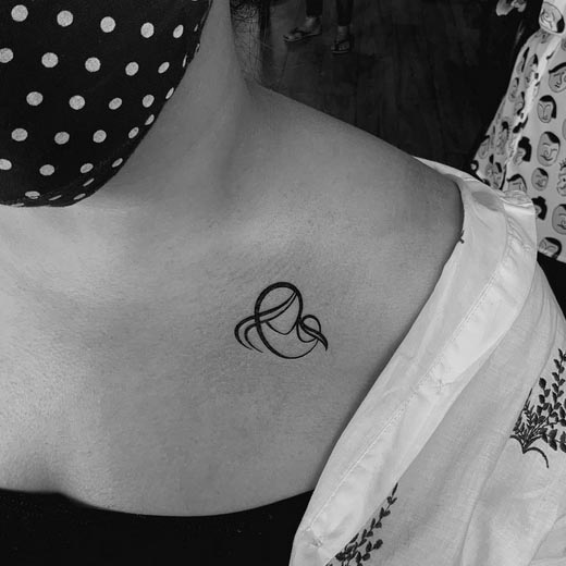 minimal geometric heart best tattoo woman collarbone