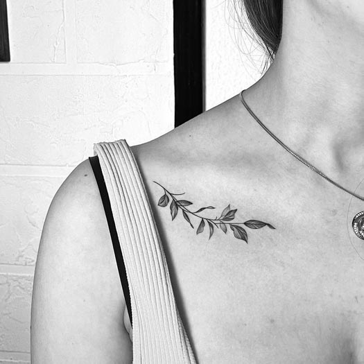 minimalist leaves tattoo design girl outer collarbone