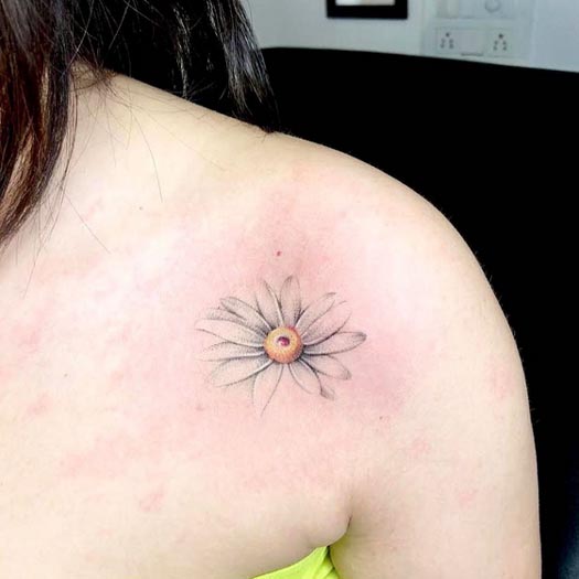 minimalistic daisy delicate tattoo design female outer collarbone