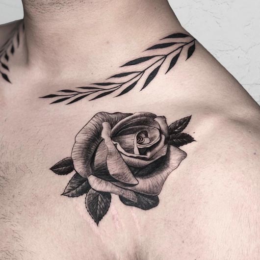 rose petal tattoo design man upper collarbone