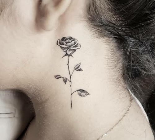 small rose easy tattoo design woman behind ear