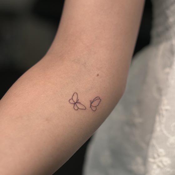 2 butterfly easy tattoo design fine line female lower inner elbow