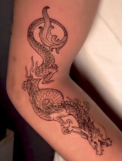 dragon tattoo design man near elbow