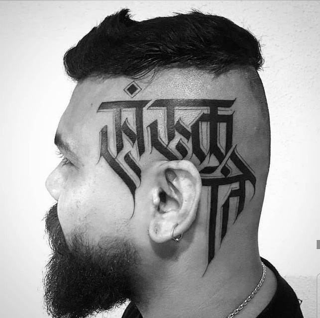 head tattoo sanskriti calligraphy