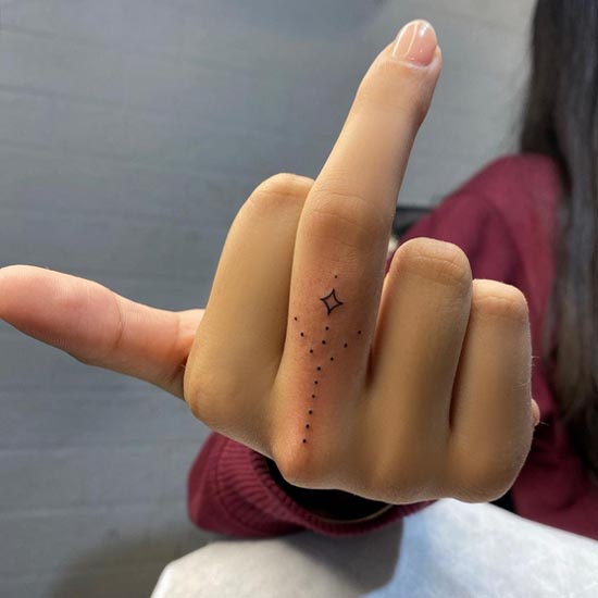 ornamental fine line tattoo idea girl middle finger