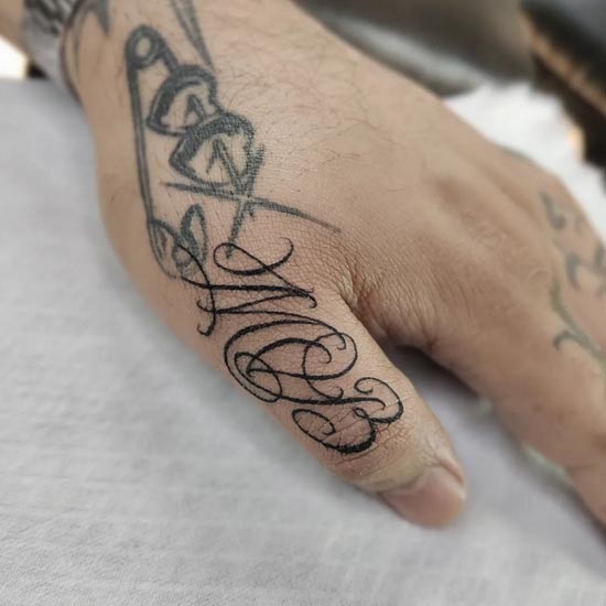 word mob calligraphy lettering script tattoo male thumb finger