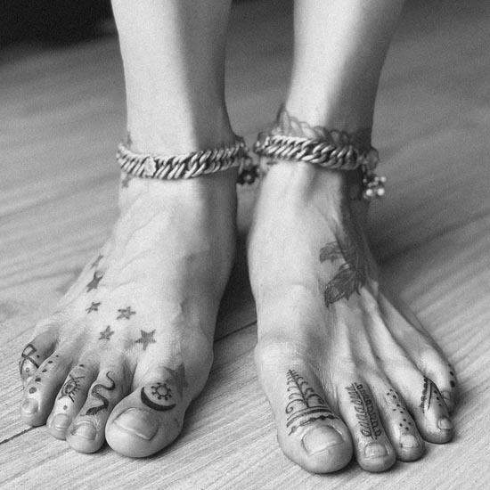 indian traditional symbols tattoo design female foot