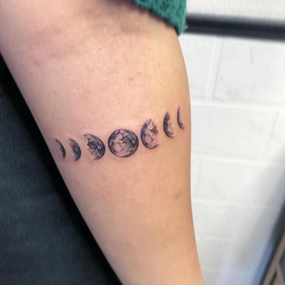 7 phases of the moon tattoo design woman inner forearm