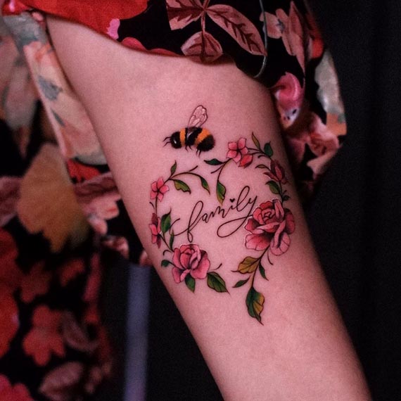 bee roses heart word family tattoo design girl forearm