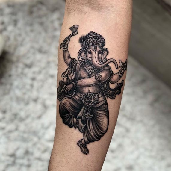 ganesha tattoo stippling black and grey man forearm