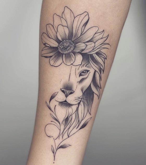 half face lioness sunflower leaves tattoo girl right forearm