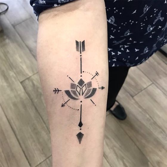 lotus arrow dotwork tattoo design woman inner forearm