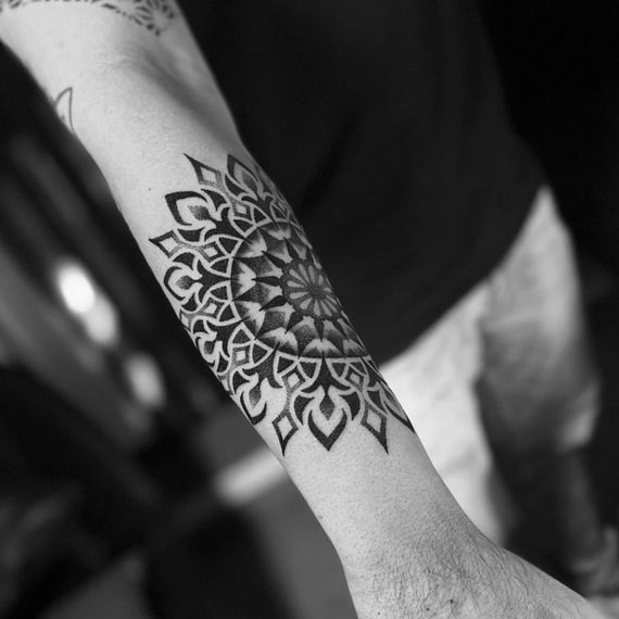 mandala big tattoo design man outer forearm 1