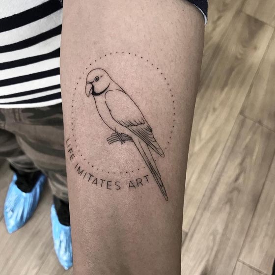 quote life imitates art parrot tattoo male left forearm