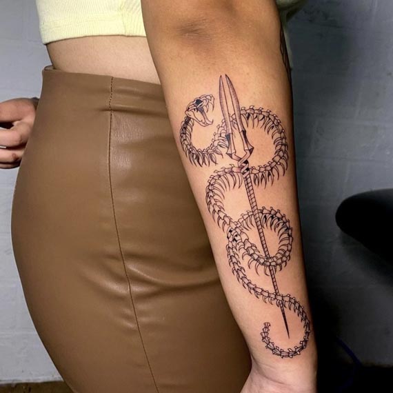 snake skeleton military fork tattoo woman right outer forearm