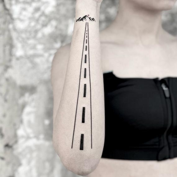 travel mountain road tattoo design female vertical forearm