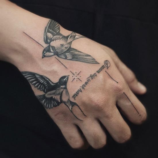 2 swallow bird flying tattoo realistic man hand