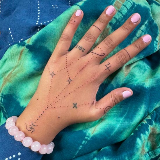 constellation cosmic om simple easy tattoo design female hand