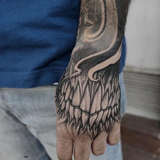 dark bio organic teeth tattoo design guy hand