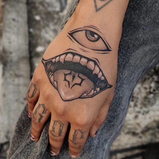 sukuna eye and mouth tattoo design male hand